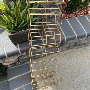 Gold wall mounted wine rack